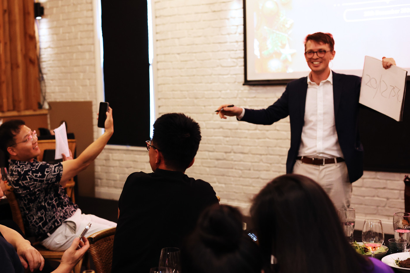 Sam King performing corporate magic at a company dinner event